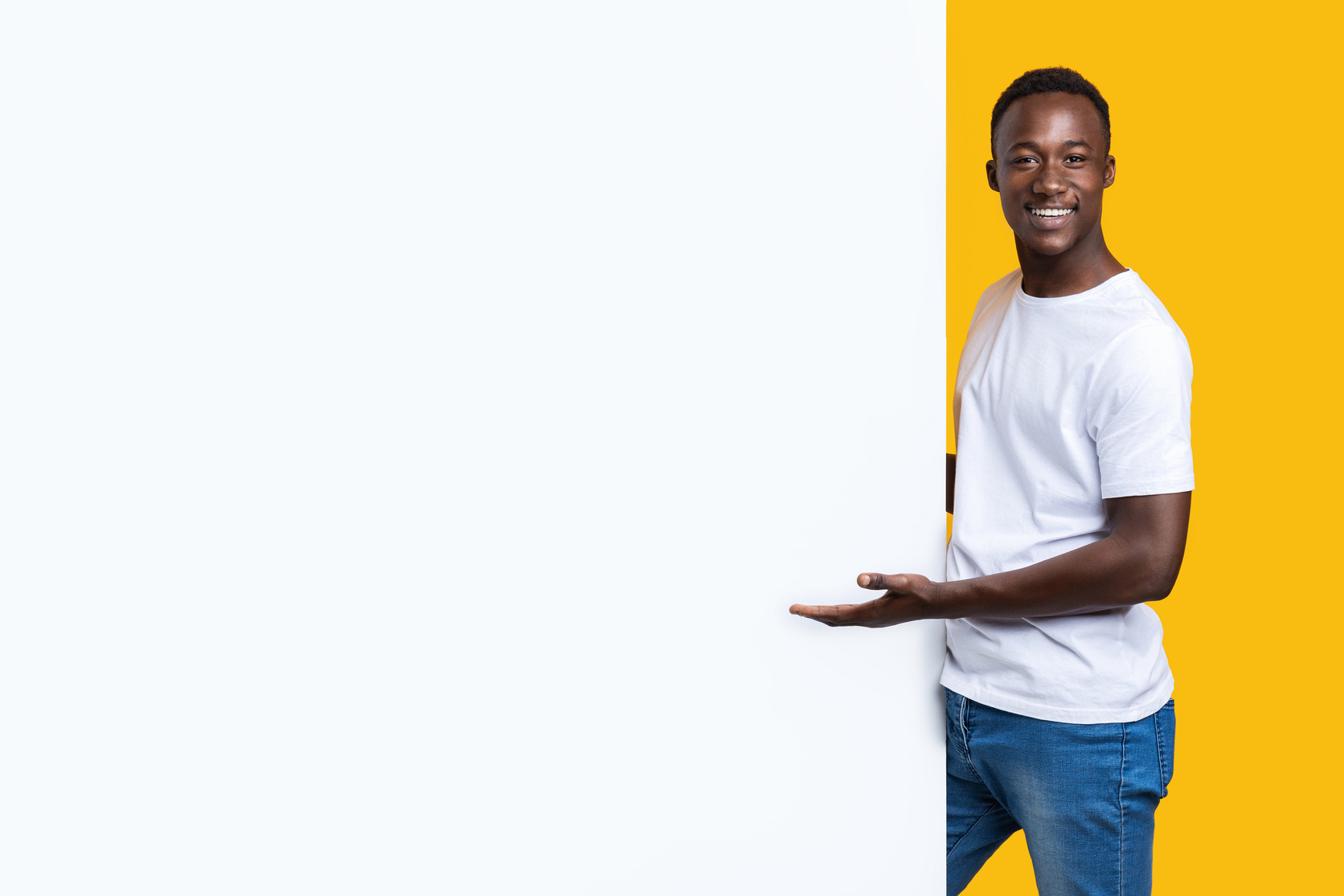 Man Pointing to a Blank Wall 